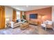 Comfortable living room showcasing contemporary design, a TV, and a cozy seating area at 2510 Petunia Garden St # 227, North Las Vegas, NV 89081