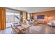 Bright living room with an open-concept layout, dining area, and lots of natural light at 2510 Petunia Garden St # 227, North Las Vegas, NV 89081