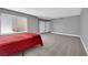 Large carpeted bedroom with gray walls, a window, and closet space at 2661 Ruthe Duarte Ave, Las Vegas, NV 89121