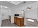 Open kitchen with a breakfast bar, adjacent to a dining and laundry area at 2661 Ruthe Duarte Ave, Las Vegas, NV 89121
