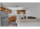 Charming kitchen featuring stainless steel appliances and a breakfast bar at 2661 Ruthe Duarte Ave, Las Vegas, NV 89121