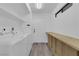 Functional laundry room with washer, dryer, and built-in shelving for extra storage at 2661 Ruthe Duarte Ave, Las Vegas, NV 89121