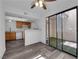 Bright living room with modern flooring and sliding glass doors to a private patio at 2661 Ruthe Duarte Ave, Las Vegas, NV 89121