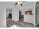 Open-concept living space connects the kitchen, fireplace and backyard with updated flooring at 2661 Ruthe Duarte Ave, Las Vegas, NV 89121