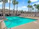 Community pool and sun deck showcasing a relaxing outdoor space lined with palm trees at 2661 Ruthe Duarte Ave, Las Vegas, NV 89121
