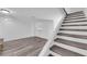 Bright staircase with modern flooring leading to the upper level of the home at 2661 Ruthe Duarte Ave, Las Vegas, NV 89121