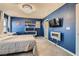 Bright bedroom featuring modern chandelier and built-in shelves at 2806 Calle Cadiz, Henderson, NV 89044