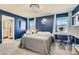 Stylish bedroom featuring a chandelier, dressing table, and ensuite bathroom at 2806 Calle Cadiz, Henderson, NV 89044