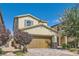 Charming two-story home featuring a brick driveway, a spacious two-car garage, and inviting landscaping at 2806 Calle Cadiz, Henderson, NV 89044