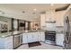 Spacious kitchen with granite countertops, stainless steel appliances, and white cabinets at 2806 Calle Cadiz, Henderson, NV 89044