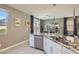 Well-lit kitchen with stainless steel appliances, granite countertops, and eat in breakfast area at 2806 Calle Cadiz, Henderson, NV 89044