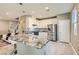 Modern kitchen with a large center island, stainless steel appliances, and a stylish backsplash at 2806 Calle Cadiz, Henderson, NV 89044