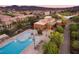 Aerial view of a community pool area with lounge chairs and landscaping at 2806 Calle Cadiz, Henderson, NV 89044