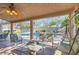Relaxing outdoor living space with a covered patio, comfortable seating, and a view of the sparkling pool at 313 Glenridding St, Las Vegas, NV 89183