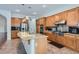 Open kitchen with granite countertops, stainless steel appliances, and custom cabinetry at 313 Glenridding St, Las Vegas, NV 89183