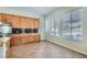 Bright eat-in kitchen area with tiled flooring, generous cabinet space, and backyard views at 313 Glenridding St, Las Vegas, NV 89183