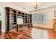 Elegant living room featuring a built-in bookcase and hardwood floors at 313 Glenridding St, Las Vegas, NV 89183