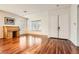 Spacious living room with hardwood floors, large windows, and modern lighting at 313 Glenridding St, Las Vegas, NV 89183