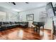 Spacious living room features hardwood floors, a comfortable sectional sofa, and stylish decor at 313 Glenridding St, Las Vegas, NV 89183