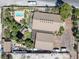 Aerial view featuring a sparkling swimming pool and patio surrounded by mature landscaping at 3330 Wedo Way, North Las Vegas, NV 89031