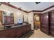 Luxurious bathroom featuring dual vessel sinks, dark wood cabinetry, and elegant lighting fixtures at 3330 Wedo Way, North Las Vegas, NV 89031