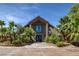 Stately home exterior with stone accents, mature landscaping, and striking architecture at 3330 Wedo Way, North Las Vegas, NV 89031