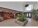 Dramatic foyer with a large window, high ceiling, and lush indoor plants at 3330 Wedo Way, North Las Vegas, NV 89031