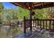 Private pond with waterfall feature viewed from a covered patio at 3330 Wedo Way, North Las Vegas, NV 89031