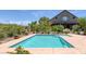 Backyard pool with mature landscaping around a house with a blue sky at 3330 Wedo Way, North Las Vegas, NV 89031