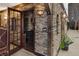 Unique wine cellar with stone walls, glass door, and custom wine racks for storing your collection at 3330 Wedo Way, North Las Vegas, NV 89031