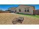 Spacious backyard with gravel landscaping, artificial turf accents, and brick paver patio at 3716 W Colton Ave, North Las Vegas, NV 89032