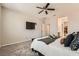 Bright bedroom with a ceiling fan, carpeted floor, and neutral walls at 3716 W Colton Ave, North Las Vegas, NV 89032