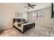 Bedroom with plush carpeting, lots of natural light, and ceiling fan at 3716 W Colton Ave, North Las Vegas, NV 89032