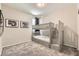 Cozy bedroom with a gray bunk bed, carpeted floors, and two framed pictures on the wall at 3716 W Colton Ave, North Las Vegas, NV 89032