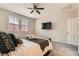 Bedroom featuring a ceiling fan, neutral walls, carpeted floor, and natural light at 3716 W Colton Ave, North Las Vegas, NV 89032