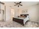 Comfortable bedroom with a ceiling fan and carpeted floors at 3716 W Colton Ave, North Las Vegas, NV 89032