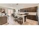 Open kitchen with stainless appliances, a center island, and a breakfast bar at 3716 W Colton Ave, North Las Vegas, NV 89032
