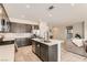 Modern kitchen with stainless appliances, tile floors, and a center island with seating at 3716 W Colton Ave, North Las Vegas, NV 89032