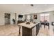 Open concept kitchen and living area with tile flooring and natural light at 3716 W Colton Ave, North Las Vegas, NV 89032