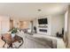 Cozy living area with a large sectional, modern fireplace, and bright, neutral décor at 3716 W Colton Ave, North Las Vegas, NV 89032