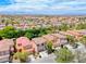 Expansive aerial view of a residential community with neat landscaping and mountain views at 4044 Villeroy Ave, Las Vegas, NV 89141