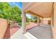 Charming covered back patio overlooking putting green in backyard, ideal for outdoor entertaining at 4044 Villeroy Ave, Las Vegas, NV 89141
