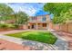 Large backyard with putting green, mature trees, and patio, ideal for outdoor living and entertaining at 4044 Villeroy Ave, Las Vegas, NV 89141