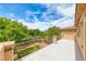 Outdoor balcony featuring concrete flooring and wrought iron railings, offering scenic community views at 4044 Villeroy Ave, Las Vegas, NV 89141