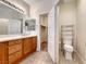 Bathroom with tiled floor, vanity with ample storage, and convenient toilet area at 4044 Villeroy Ave, Las Vegas, NV 89141