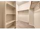 Walk-in closet featuring built-in shelving for optimized storage and organization at 4044 Villeroy Ave, Las Vegas, NV 89141