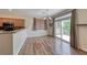 Bright dining area with sliding glass doors to balcony and modern light fixture at 4044 Villeroy Ave, Las Vegas, NV 89141