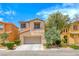Charming two-story home with a well-manicured front lawn and attached two-car garage at 4044 Villeroy Ave, Las Vegas, NV 89141