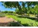 A serene green space with walking path provides a picturesque view, inviting outdoor enjoyment and community engagement at 4044 Villeroy Ave, Las Vegas, NV 89141