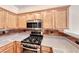 Bright kitchen featuring stainless steel appliances and granite countertops at 4044 Villeroy Ave, Las Vegas, NV 89141